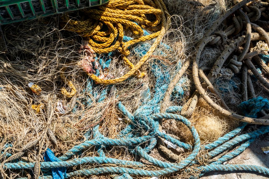 A Detail of a fisherman's net on the ground