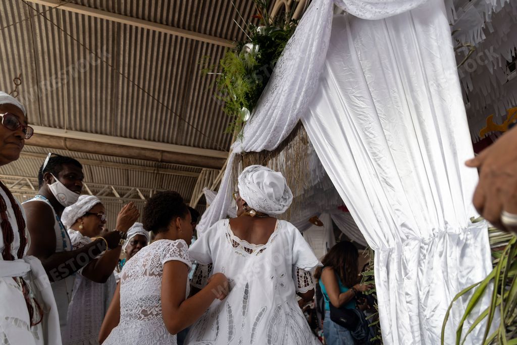 The members of Candomble religion in white clothes during a religious celebration in Santo Amaro, Brazil