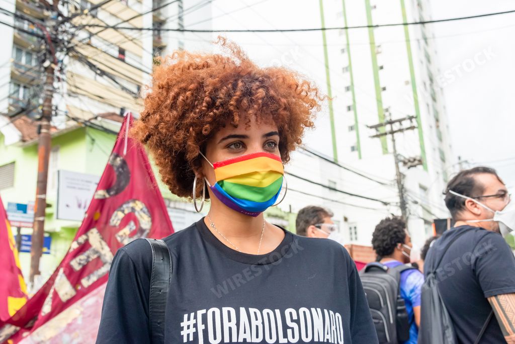 A young Brazilian in an LGBT mask protesting President Jair Bolsonaro in the city of Salvador