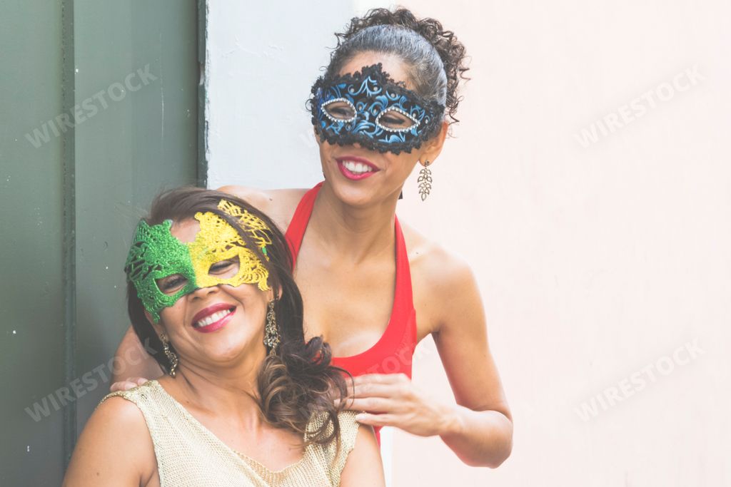 A Portrait of two women wearing Venice Carnival mask in Salvador, Bahia, Brazil