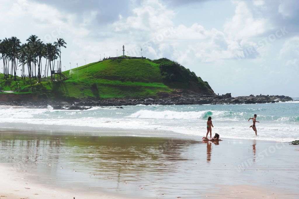 A Morro do Cristo grassy mound by the sea, with a famous statue of Jesus Christ and panoramic views