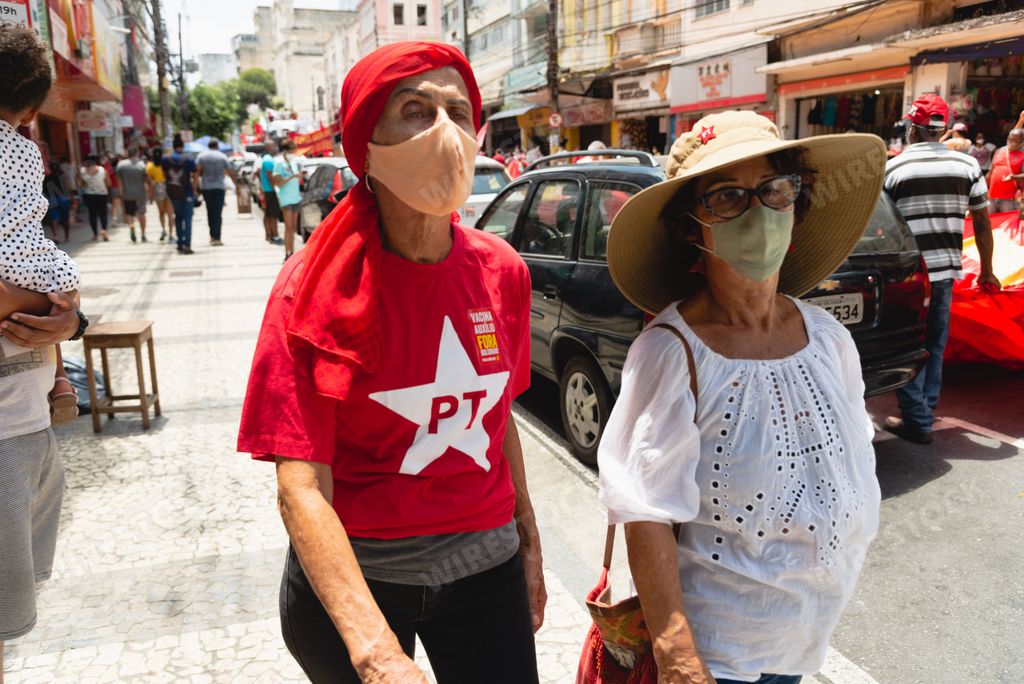 Two females Protester with face nasks walking during protest against President Jair Bolsonaro