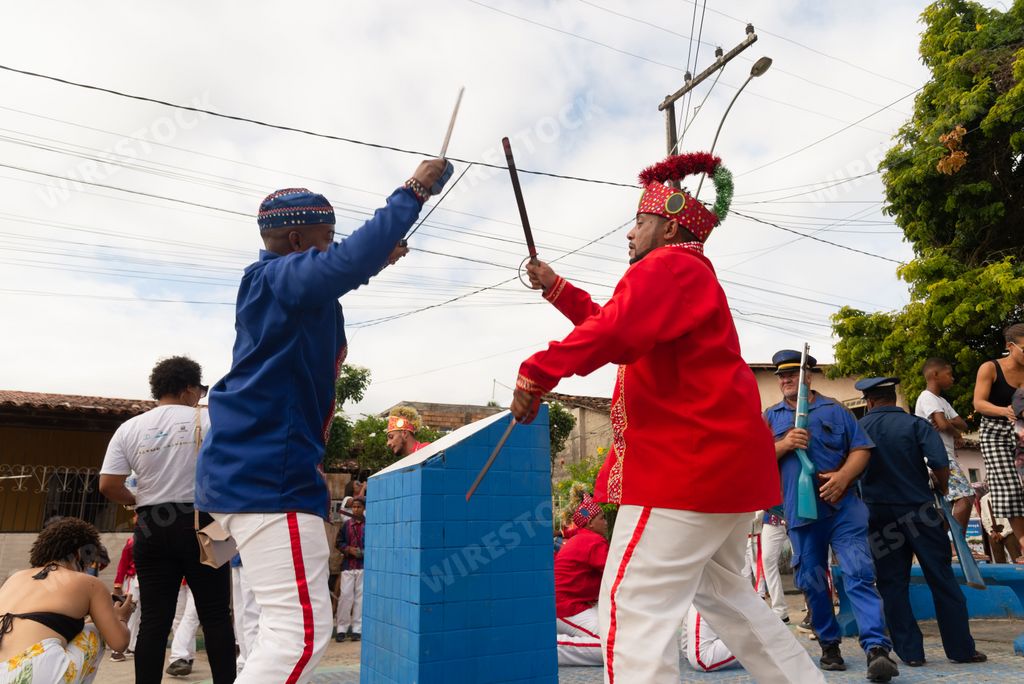 Members of the Marujada cultural event stage a sword fight between Moors and Christians in the streets Saubara, Bahia.