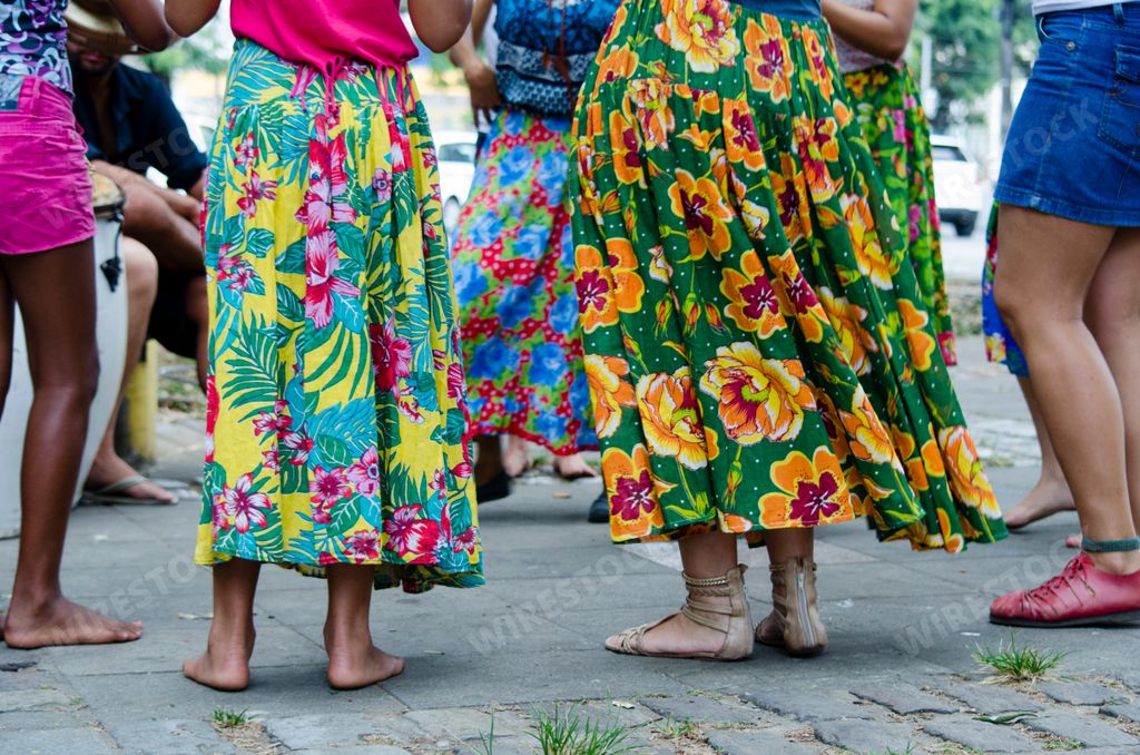 Women dancing the traditional samba de roda of Bahia with colorful clothes. Salvador, Bahia, Brazil.