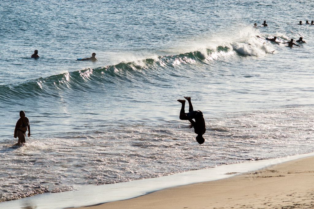 A Man does marbalism in the sands of Paciencia beach, in Rio Vermelho. Salvador Bahia Brazil