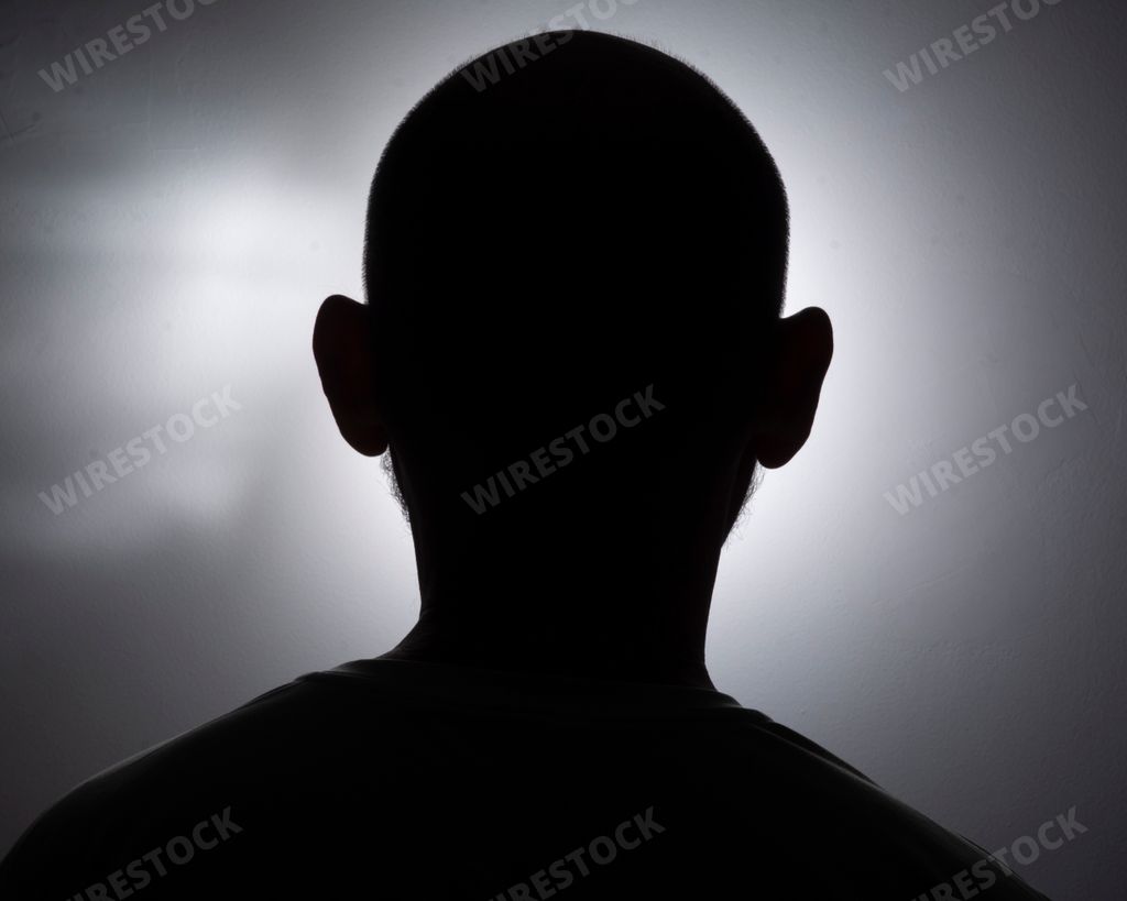 A closeup silhouette of a man's head in black and white