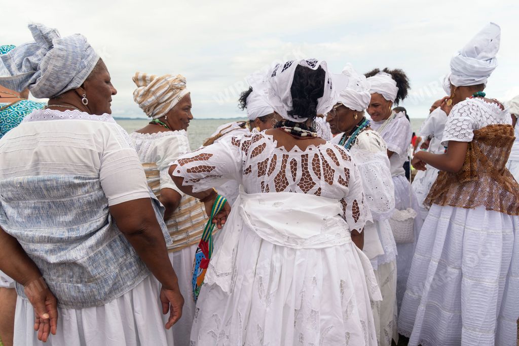 The members of Candomble religion in white clothes during a religious celebration in Santo Amaro, Brazil
