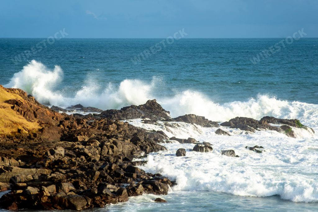 A view of sea waves breaking on the beach rocks in Salvador, Bahia, Brazil