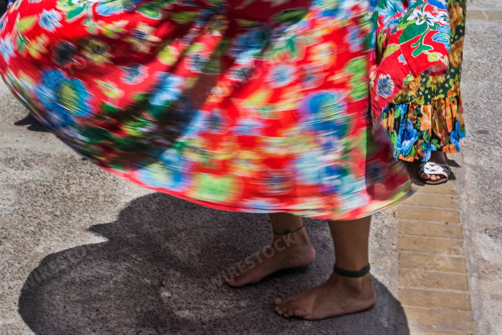 Women dancing the traditional samba de roda of Bahia with colorful clothes. Salvador, Bahia, Brazil.