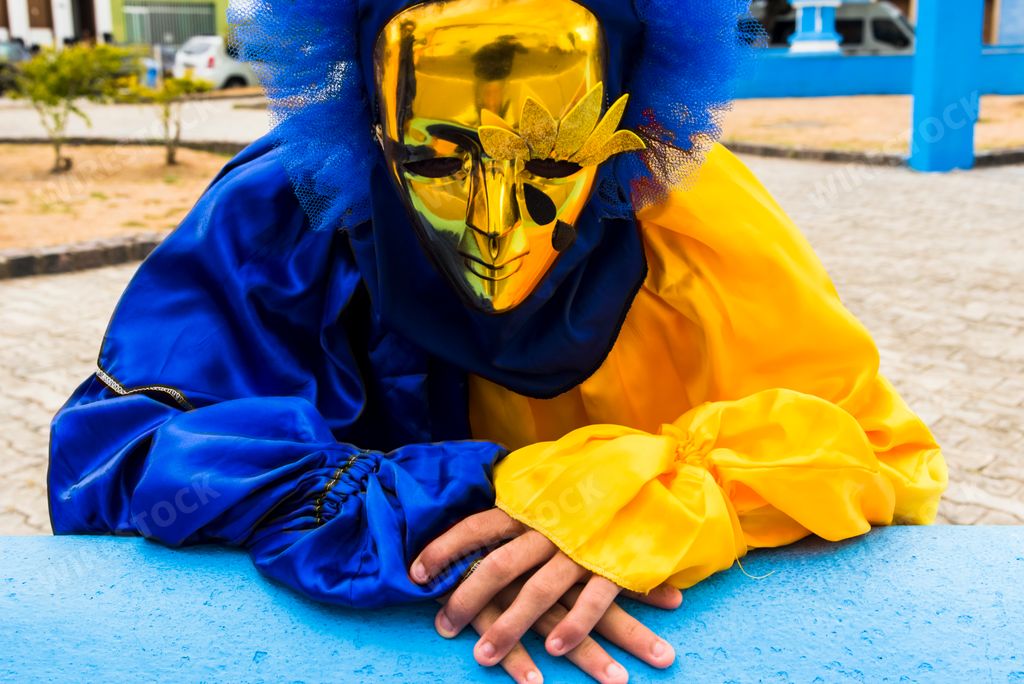 A closeup of people wearing masks and carnival costumes at Carnaval de Maragojipe in Maragogipe,Brazil