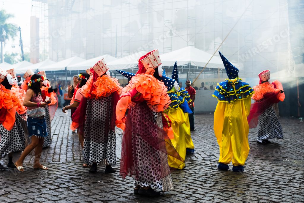 A closeup of people wearing masks and carnival costumes at Carnaval de Maragojipe in Maragogipe,Brazil