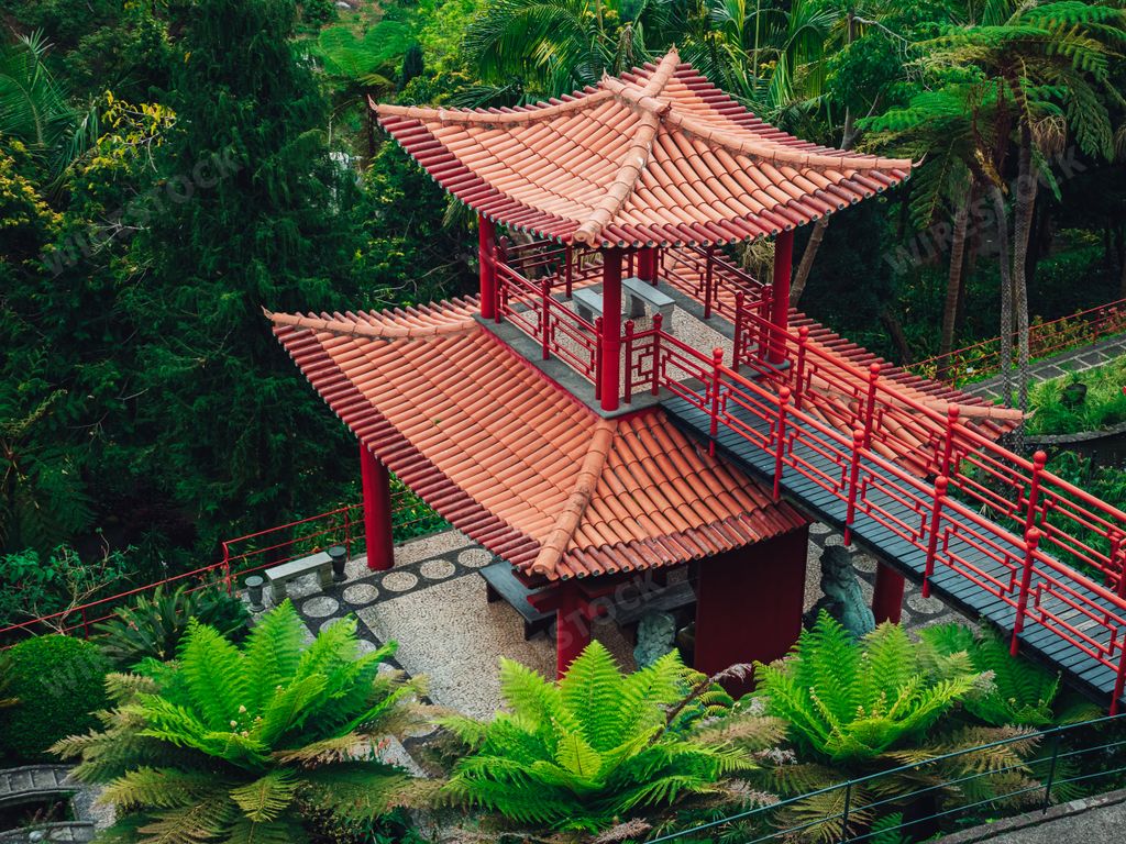 A beautiful red Chinese-style pavilion at the Tropical gardens of Monte Palace in Madeira, Portugal
