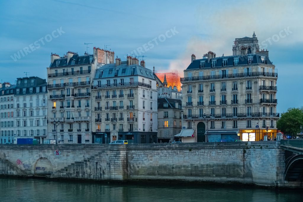 Paris, France, April 15th, 2019, the Notre-Dame cathedral burning, view from the quay and the pont dareole