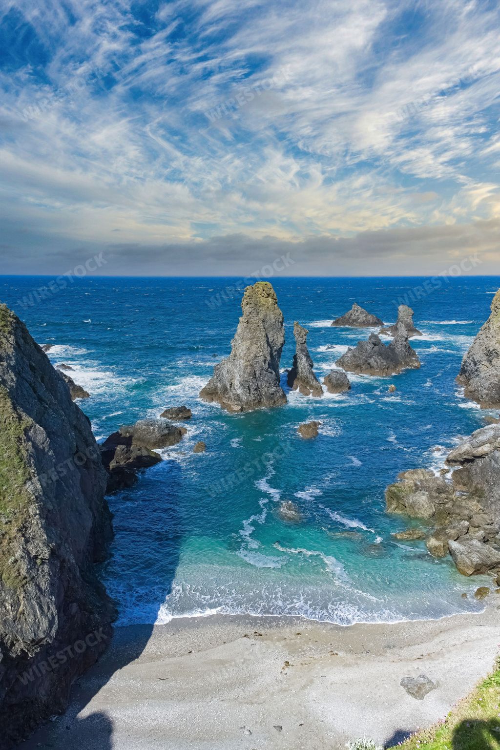 A scenic view of Belle-Ile in Brittany, seascape with rocks and cliffs on the Cote Sauvage, the needles of Port-Coton