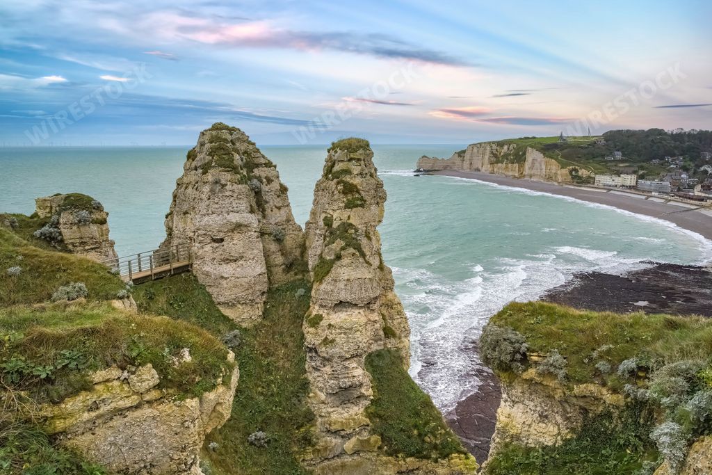 Etretat in Normandy, the famous cliffs and needle on the pebble beach
