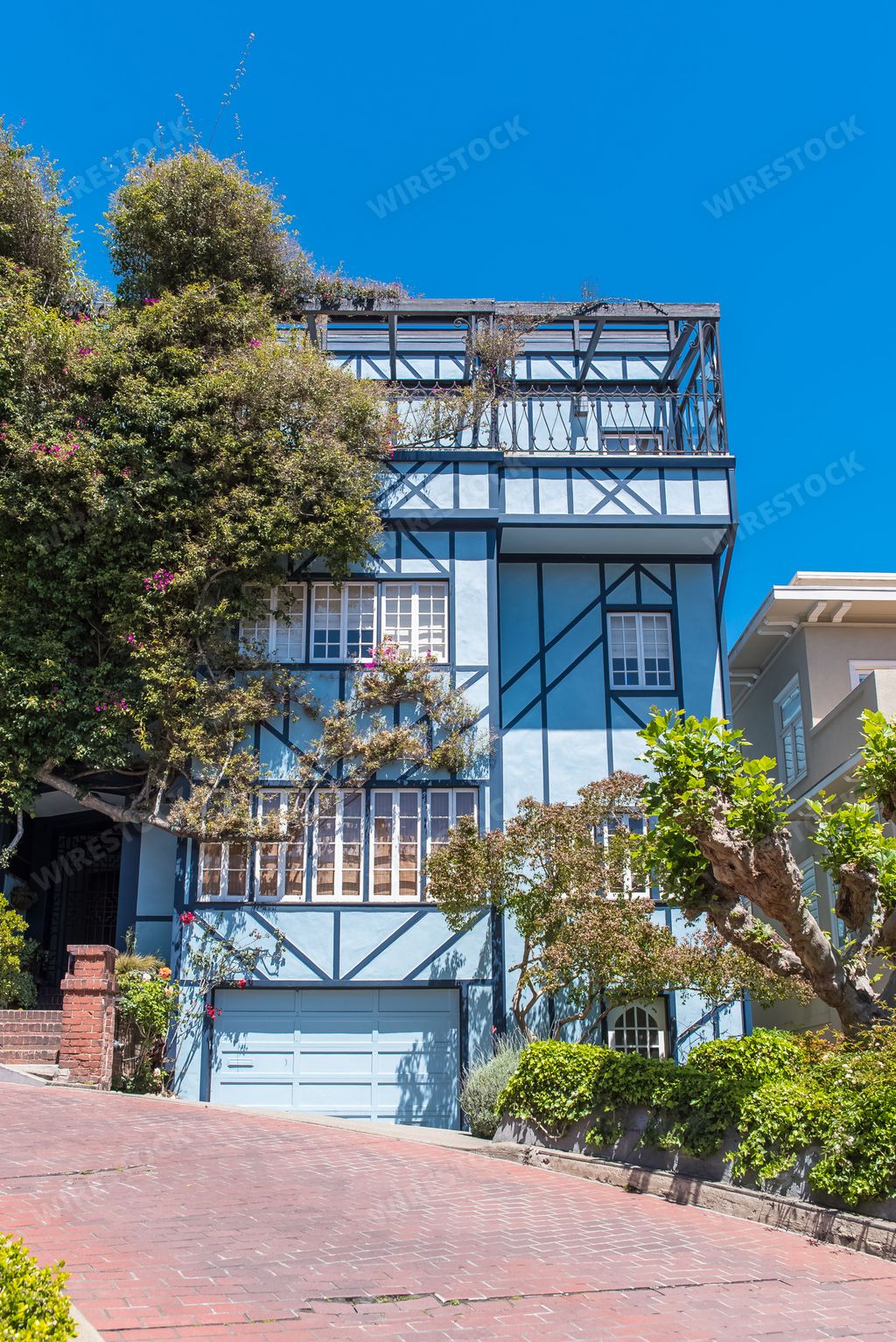 San Francisco, the famous Lombard Street, winding street in Russian Hill, with the Coit tower in background