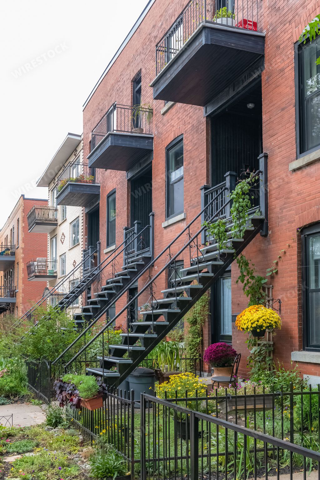 Montreal, typical victorian house with exterior staircase in the Plateau Mont-Royal district in autumn