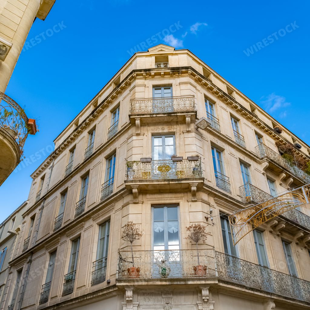 Nimes in France, old facades in the historic center, typical buildings