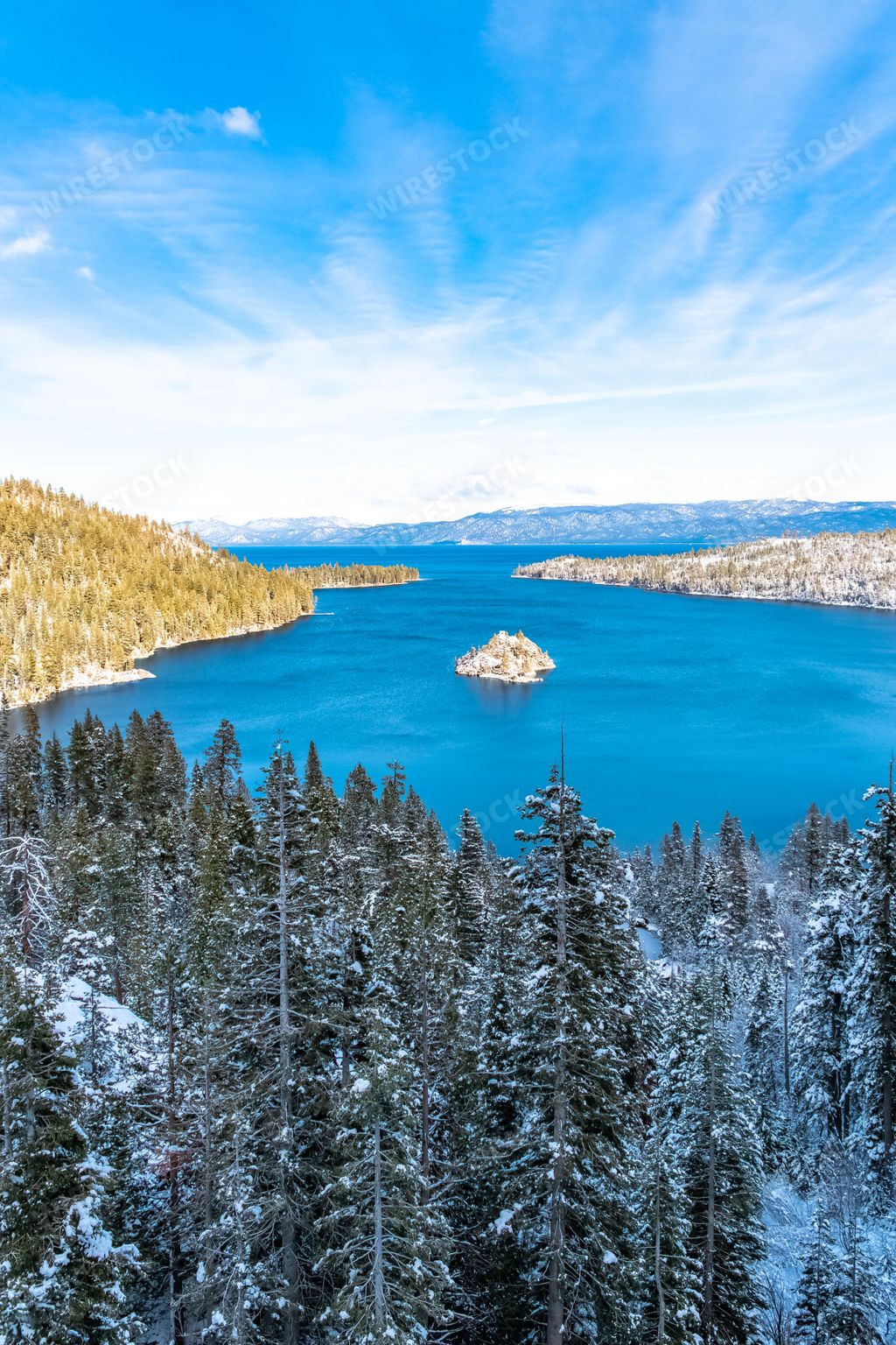 The Lake Tahoe, panorama of a mountain lake in winter, sunny day