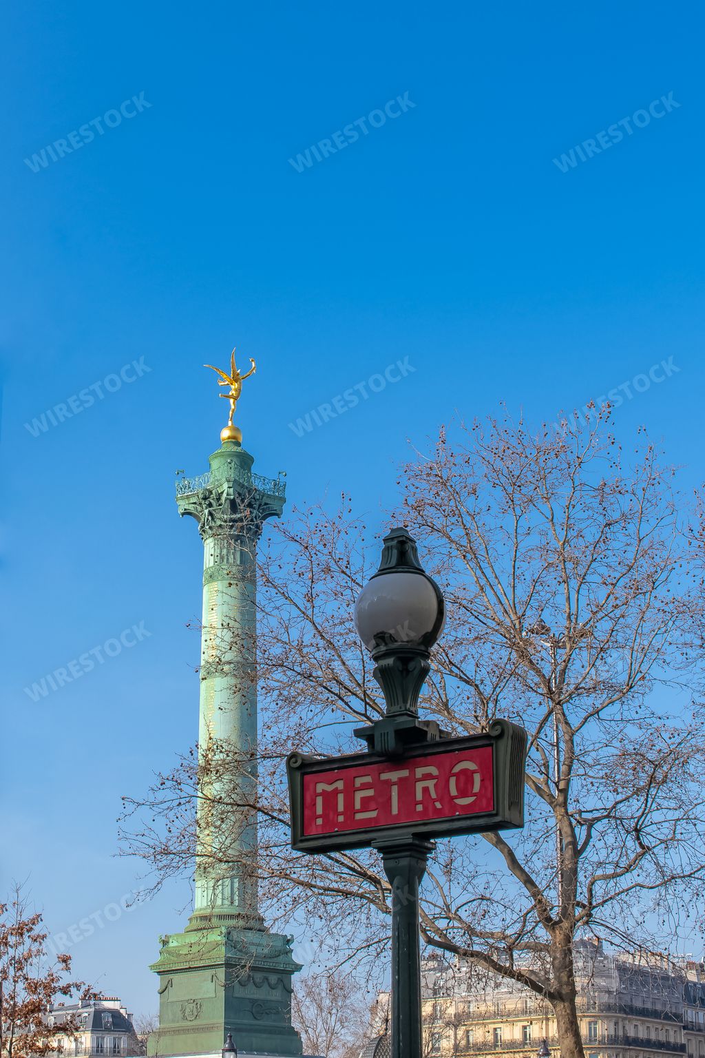 Paris, place de la Bastille, column with statue of the golden angel, and the subway sign