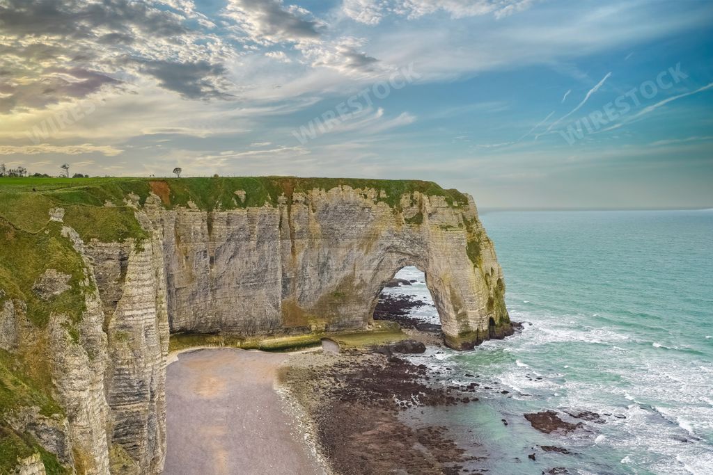 An aerial view of the Etretat in Normandy, the famous cliffs and needle on the pebble beach