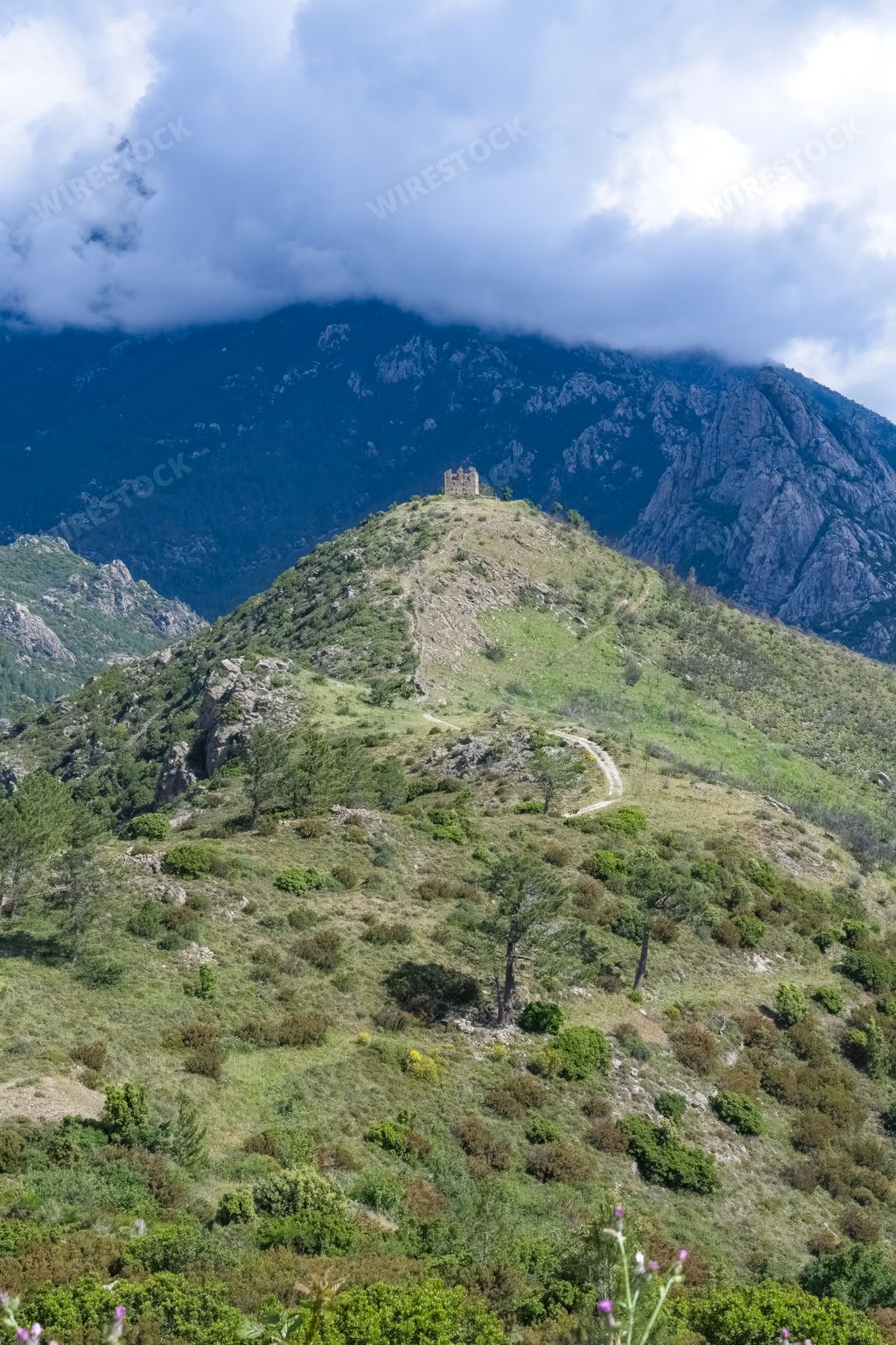A scenic view of Corsica, the ruin of the Pasciola fortress in the mountains