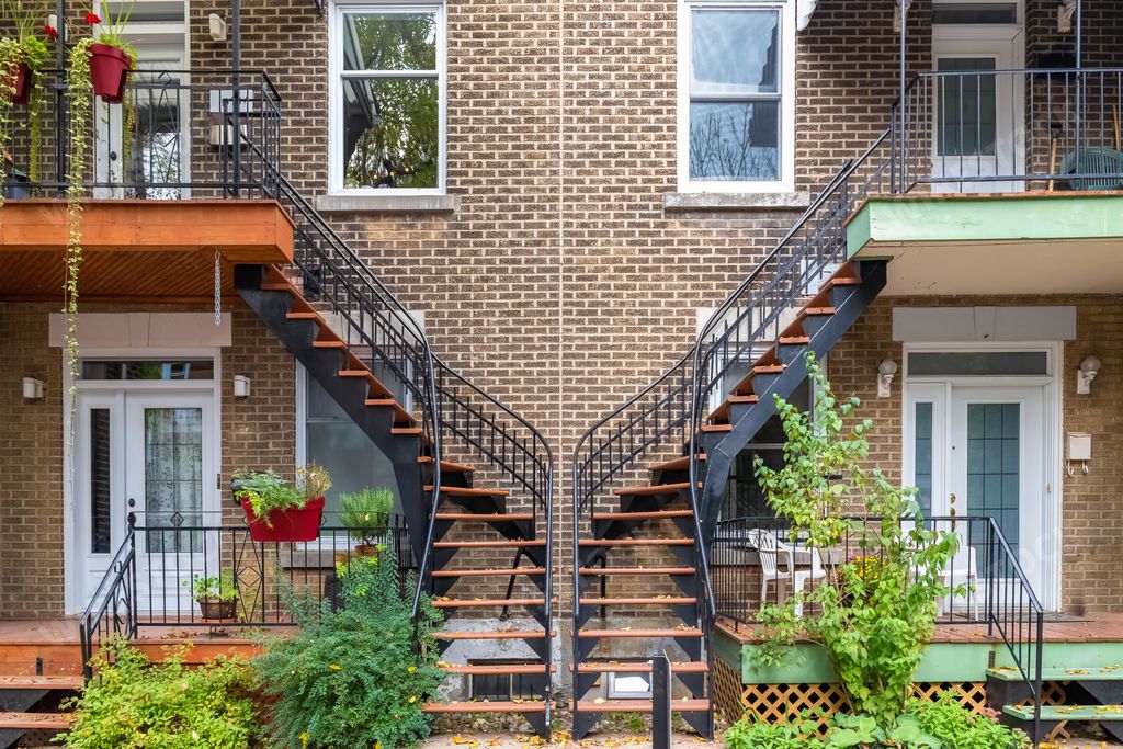 Montreal, typical victorian house with exterior staircase in the Plateau Mont-Royal district in autumn
