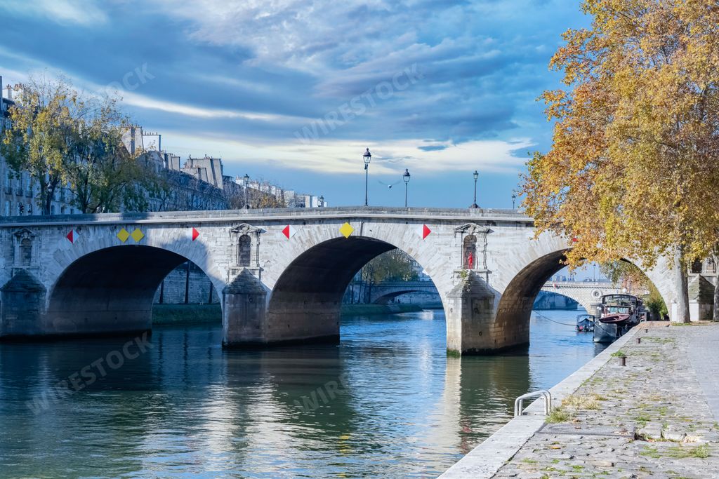 The historic stone Pont Marie Bridge over the canal in Paris, France