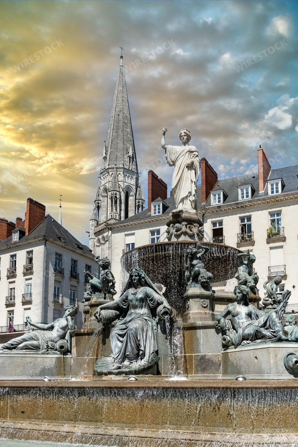 Nantes, beautiful city in France, fountain place Royale, in the historic center, with typical buildings in background
