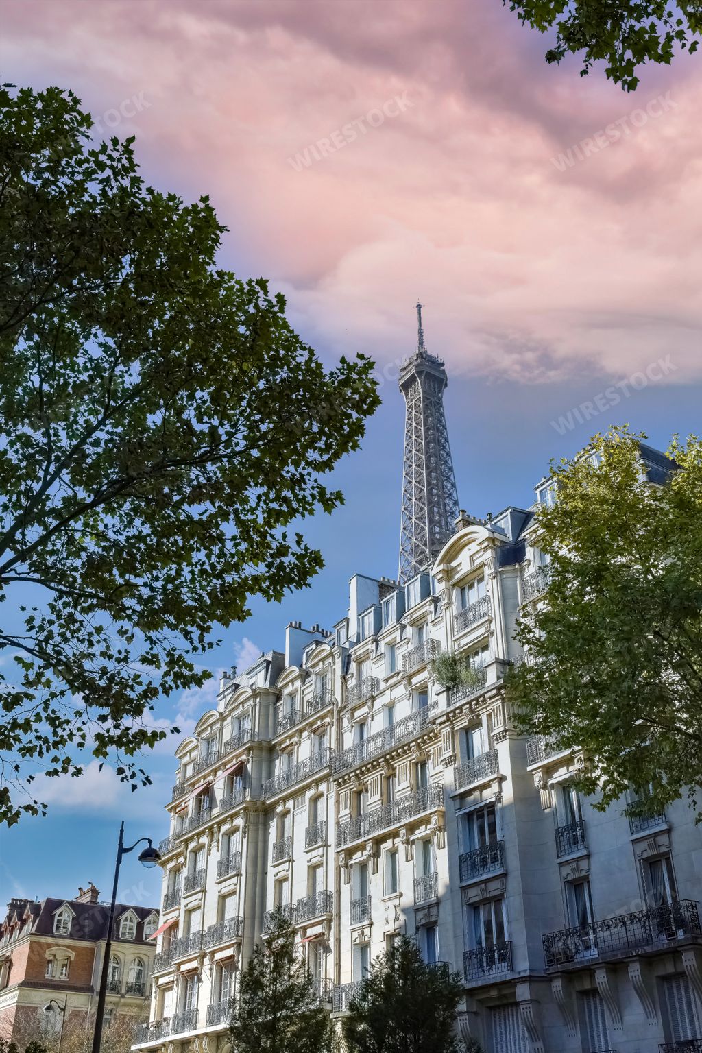 The beautiful Haussmann facades in a luxury area of Paris with the Eiffel Tower in the background