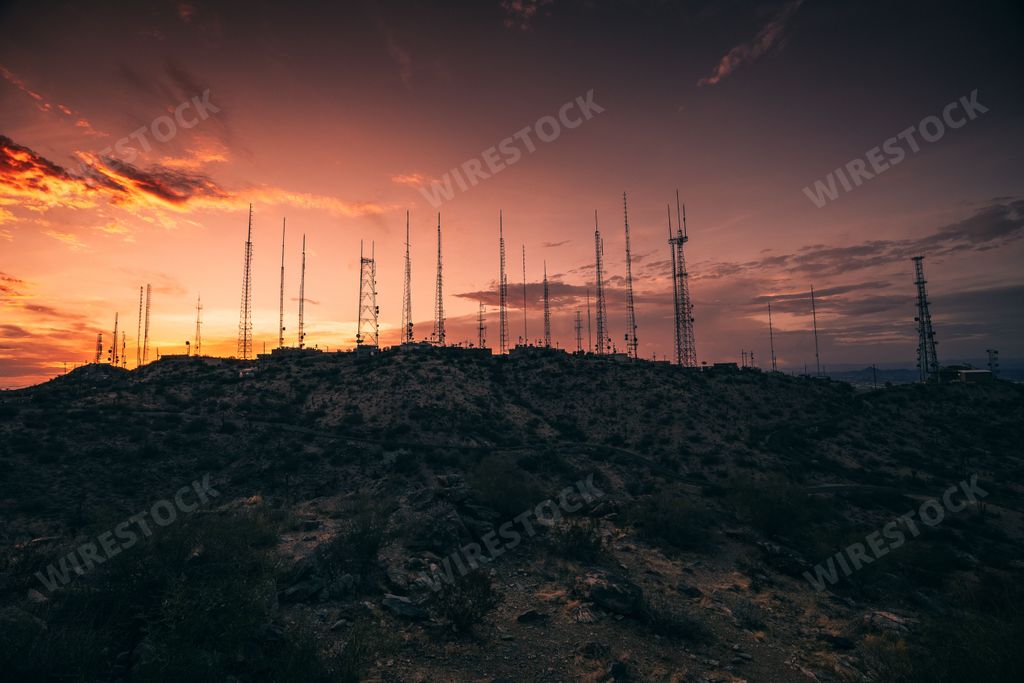 A mesmerizing pink sunset over the radio towers at the top of the South Mountain