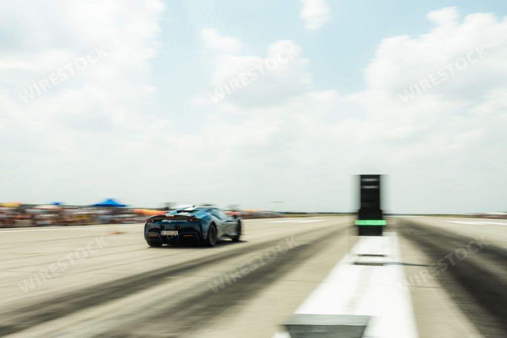 A cool blue car on the road during the Racing event at the Arad International Airport in Romania