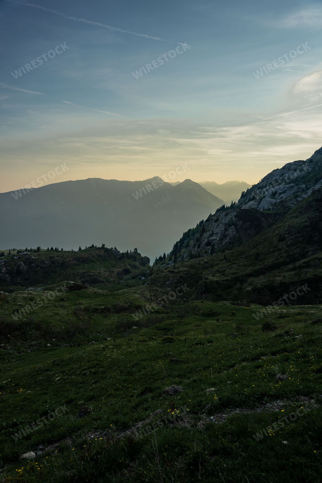 A landscape of the Carnic Alps with blue sky above in Italy, Paluzza, Friuli-Venezia Giulia at sunset