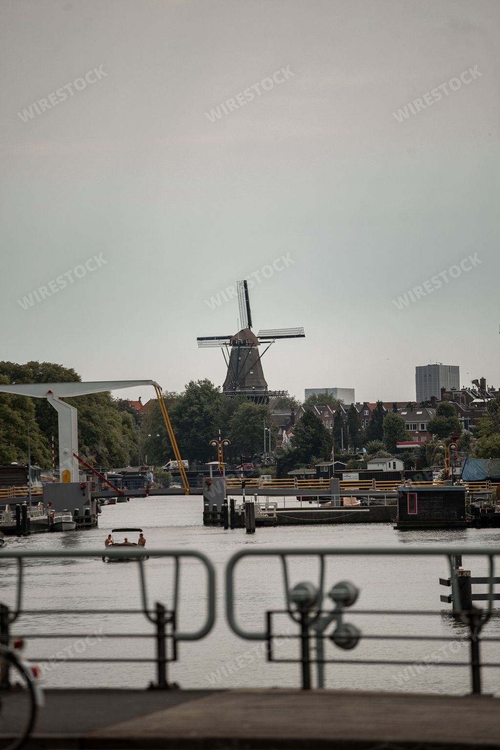 A vertical shot of a mill in Amsterdam