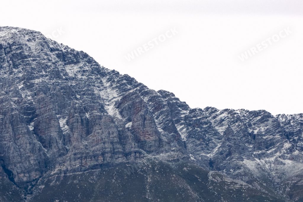 The snow-capped peaks of Breede Valley's distant mountains on a chilly day in Worcester, South Africa