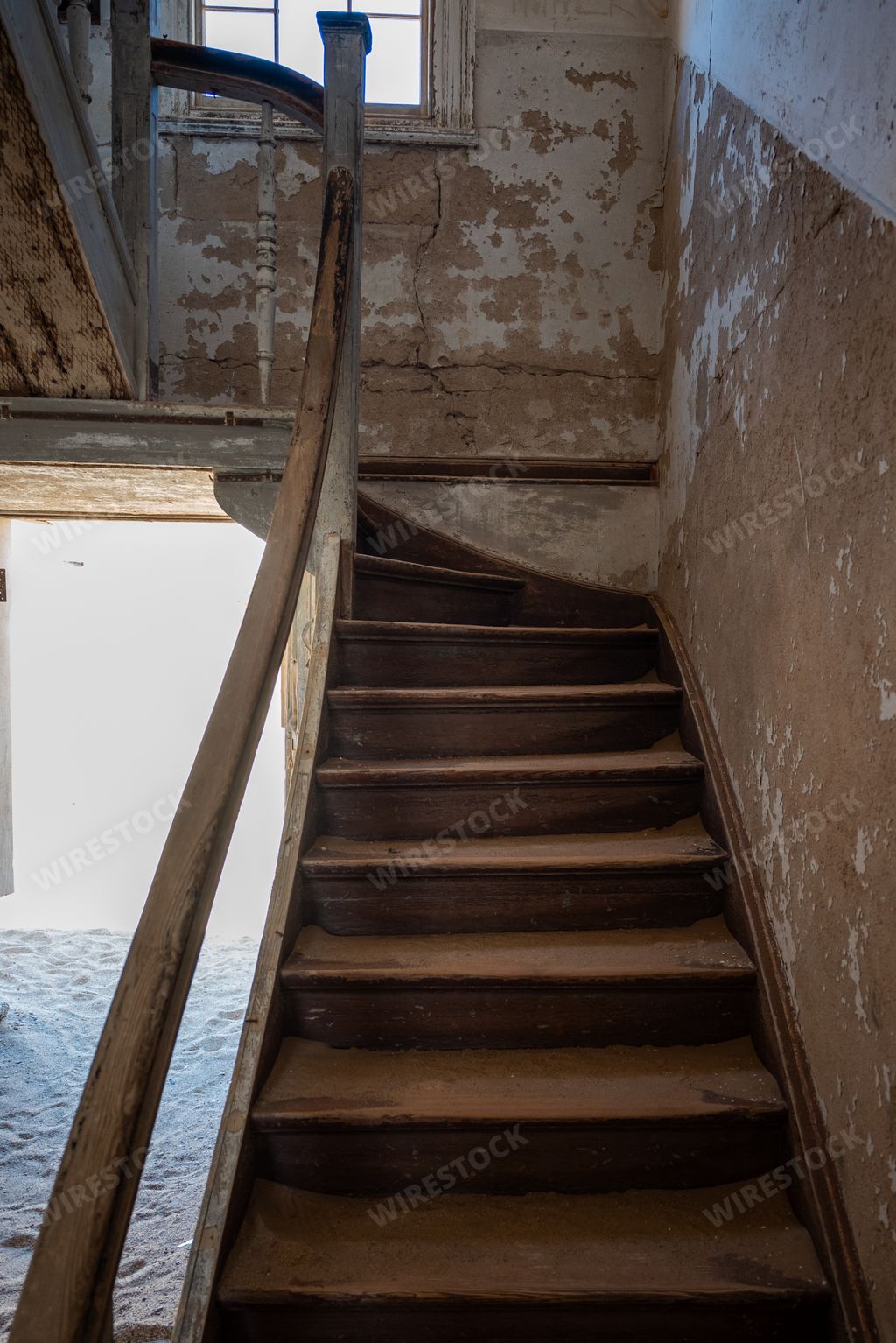 The old wooden staircase in an abandoned building in an old desert town