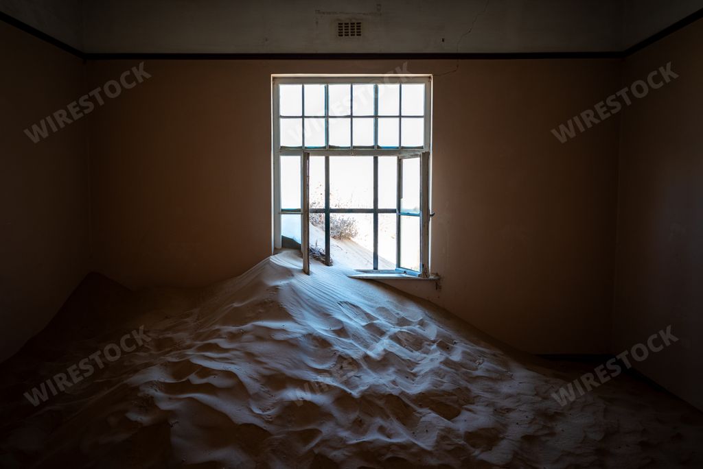 The Sand covering the floor of an abandoned building in an old desert town