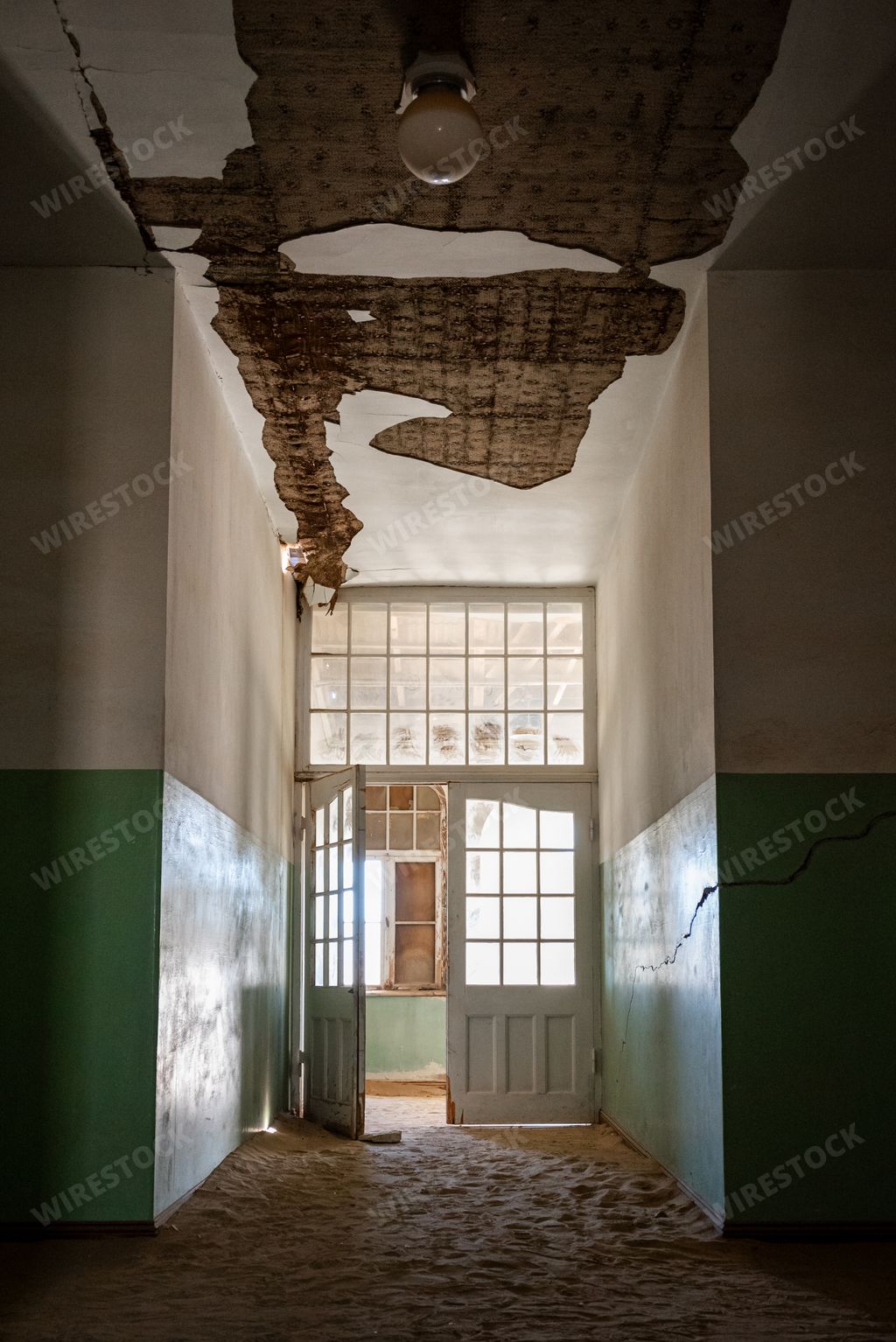Dirty hallway door with peeling wood