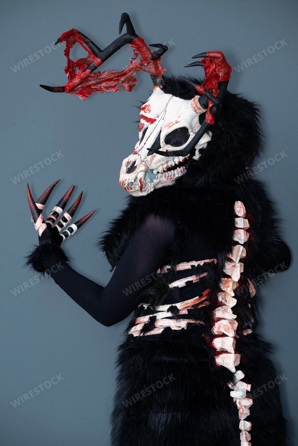 A female cosplayer dressed as a skeleton monster
