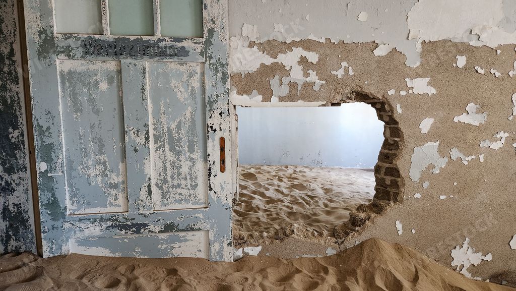 An Old, abandoned sand-filled building in the desert. Kolmanskop, Namibia.