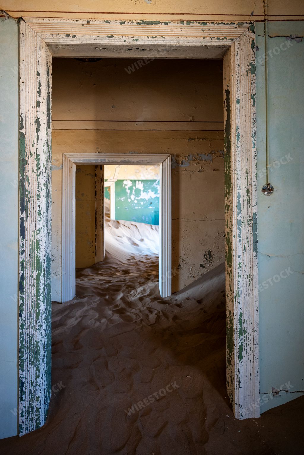 The inside of an abandoned building with textured old walls in an old desert town