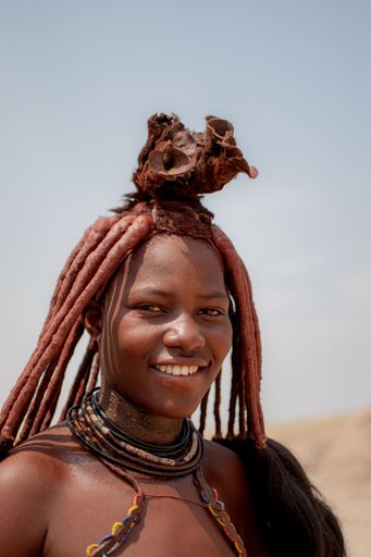 Portrait of a Himba tribe woman in traditional clothes and ornaments in ...