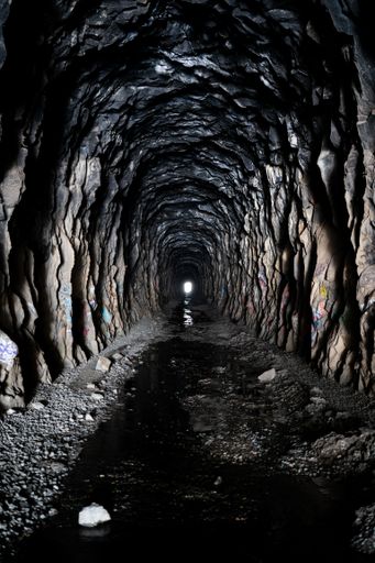 Vertical shot of the inside the Donner Summit China Wall tunnel with a ...