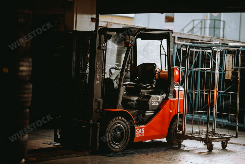 The red Toyota forklift in the warehouse, close-up