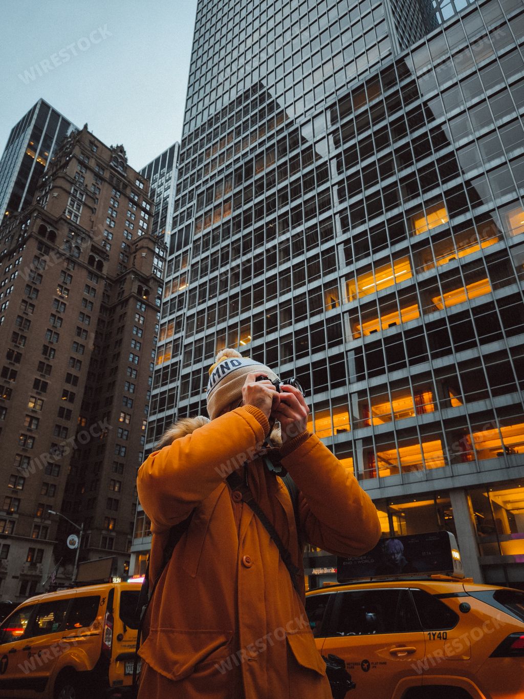 A person taking a photo of the streets in New York City, USA