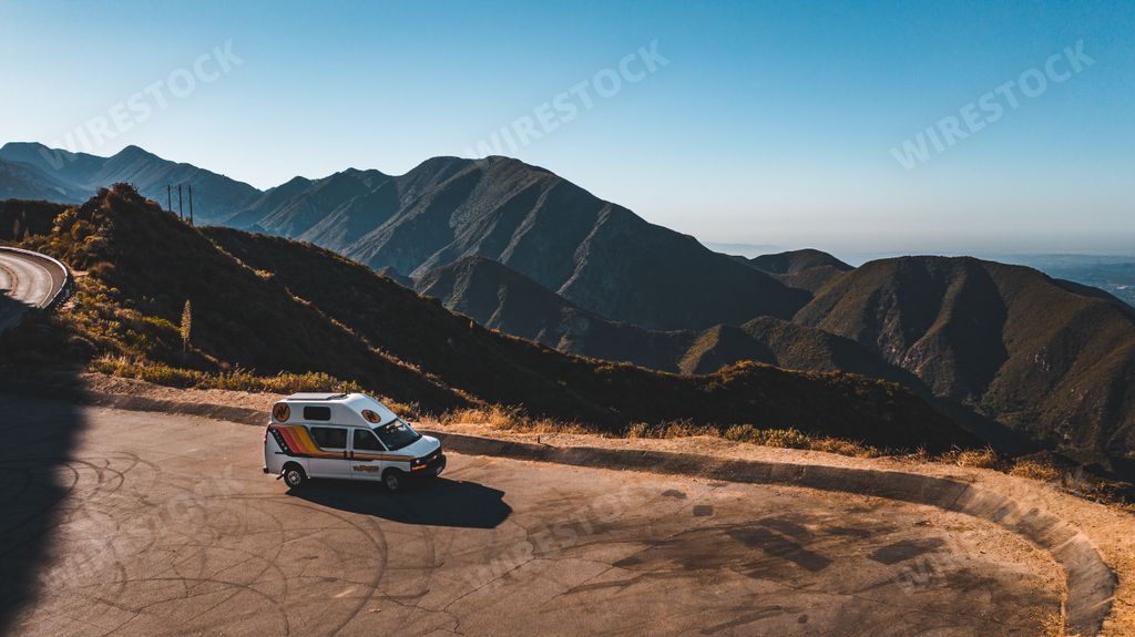 An aerial view of a camper van parked in the hills near Los Angeles.