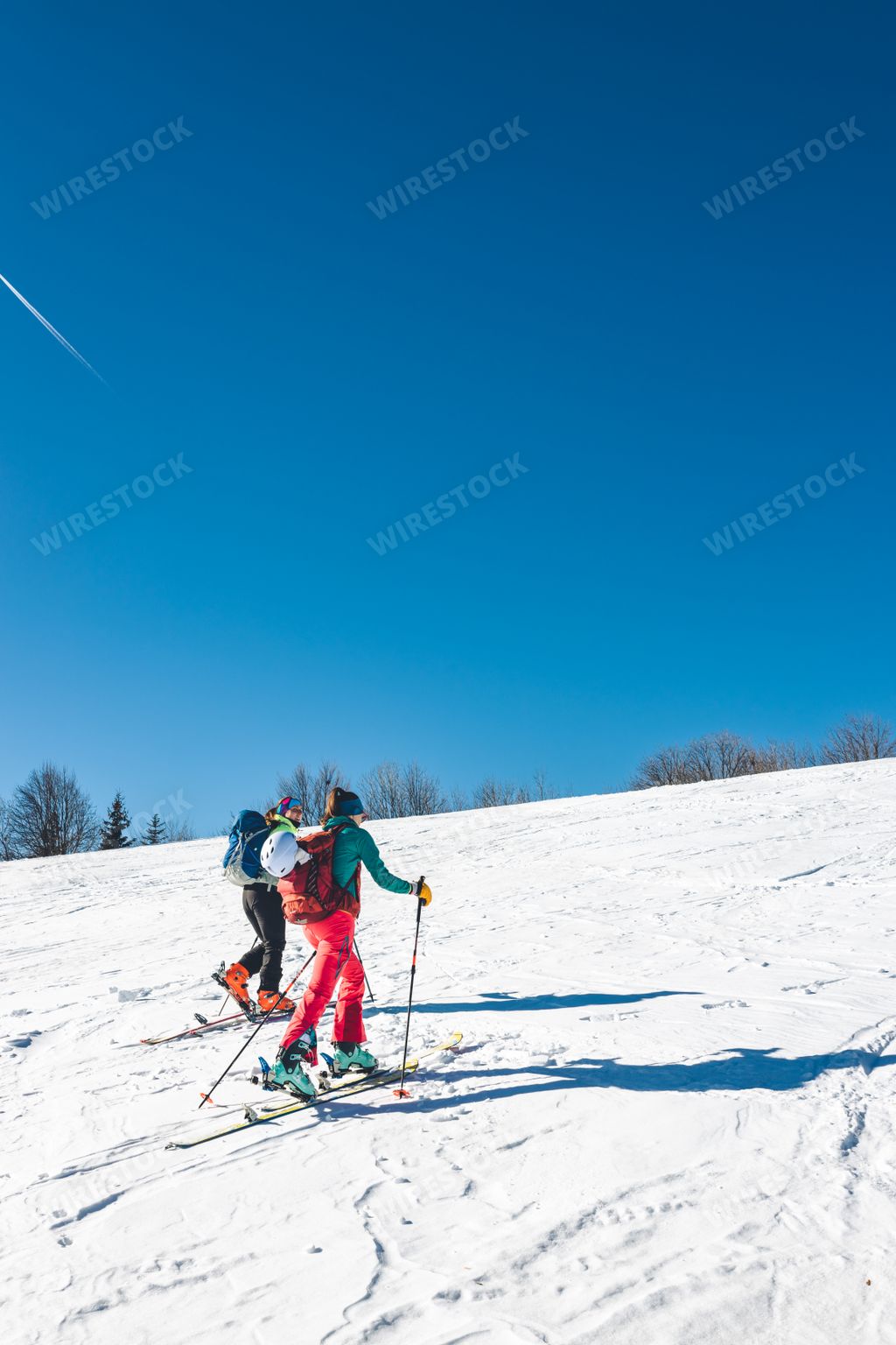 A vertical shot of skiers going up the Pansky Diel trail near Banska Bystrica, Slovakia