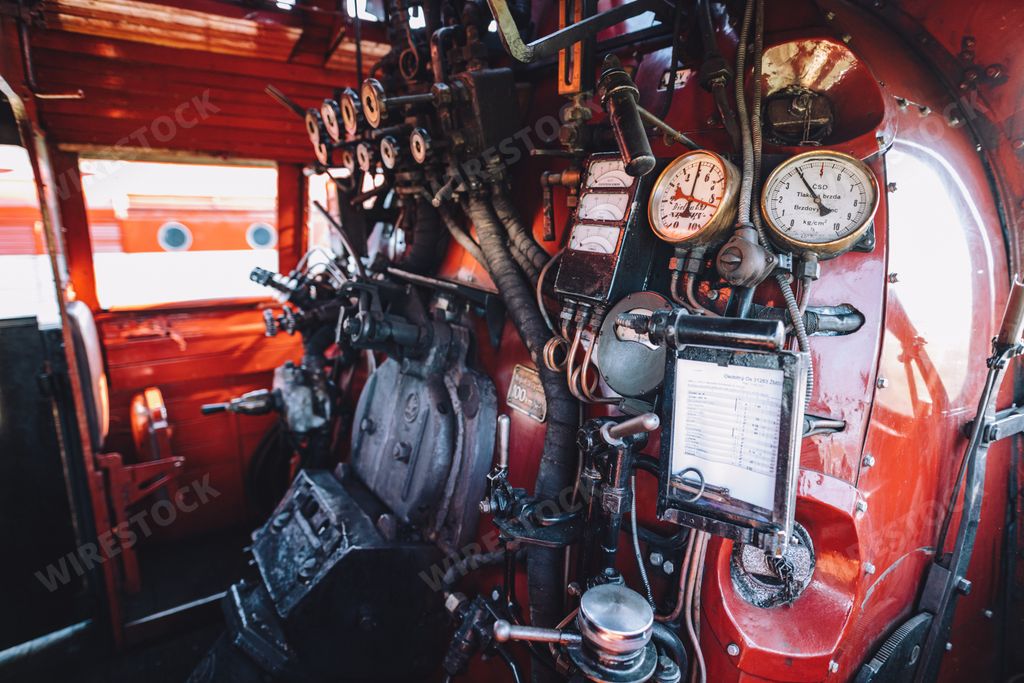 A closeup shot of the look inside the cabin of steam engine locomotive 475.196