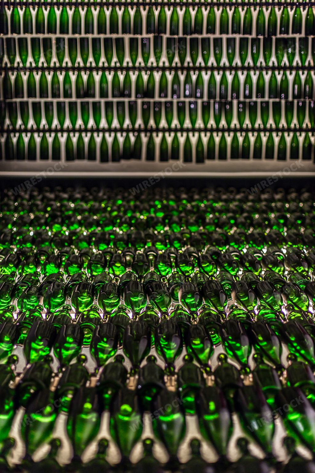 A closeup shot of green glass bottles with a blurred background