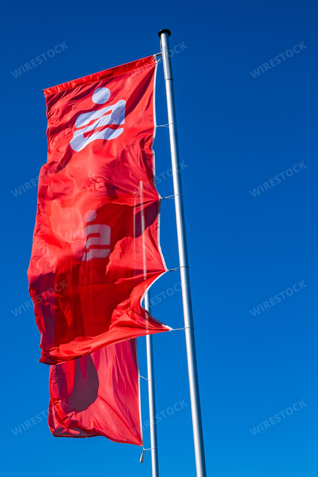 Flags with the red Logo of the german Savings Bank - Sparkasse - in front of a branch in Verlautenheide, Aachen
